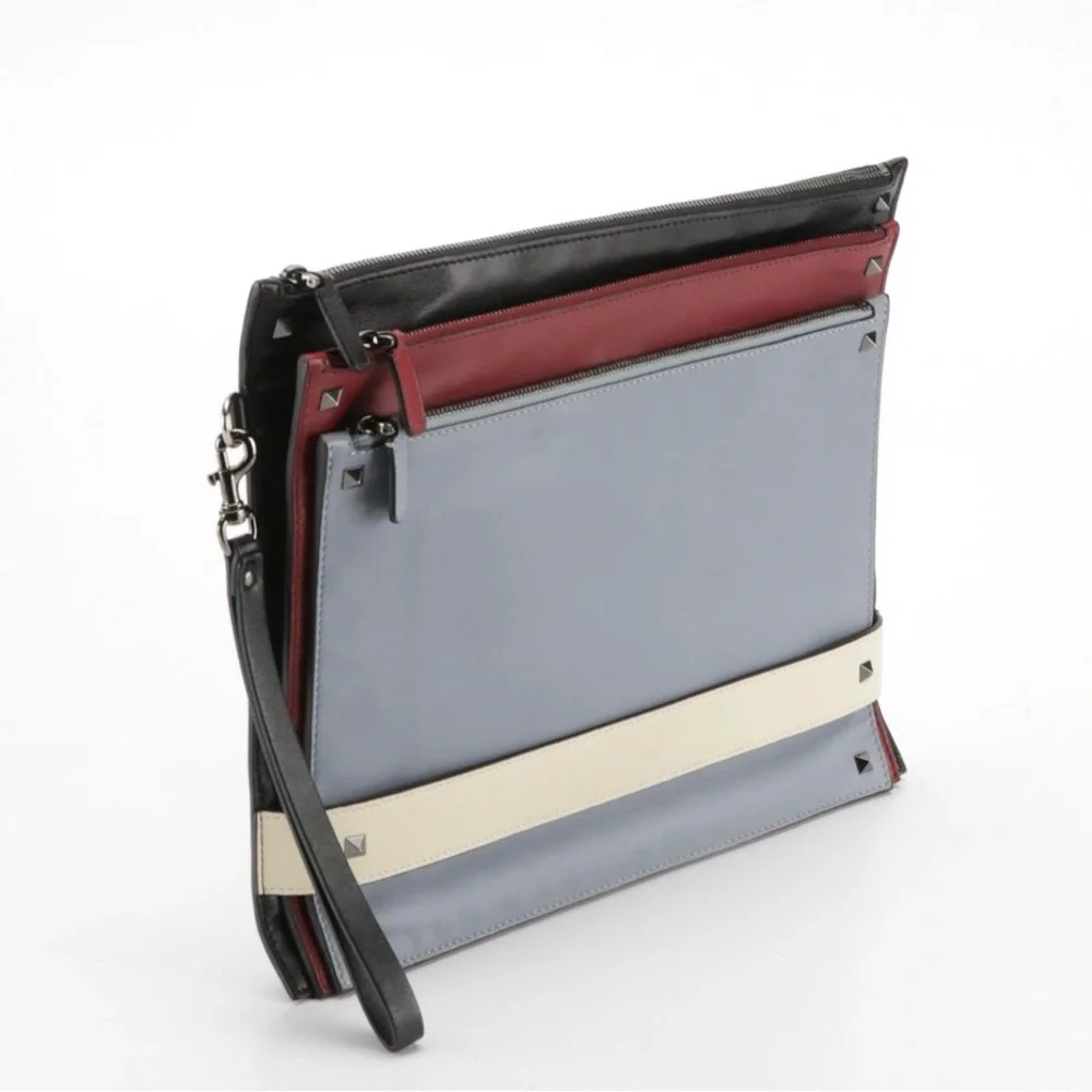 Valentino Garavani Rockstud Triple Zip Clutch in Calfskin Leather Red/Blk/Blu/Wh